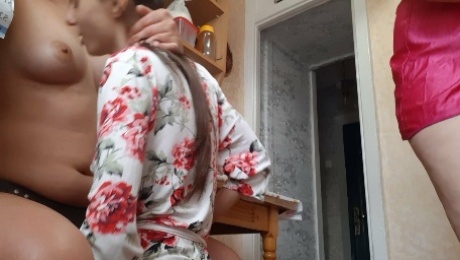 Fucked a girl with a strapon while the housemaid was cooking